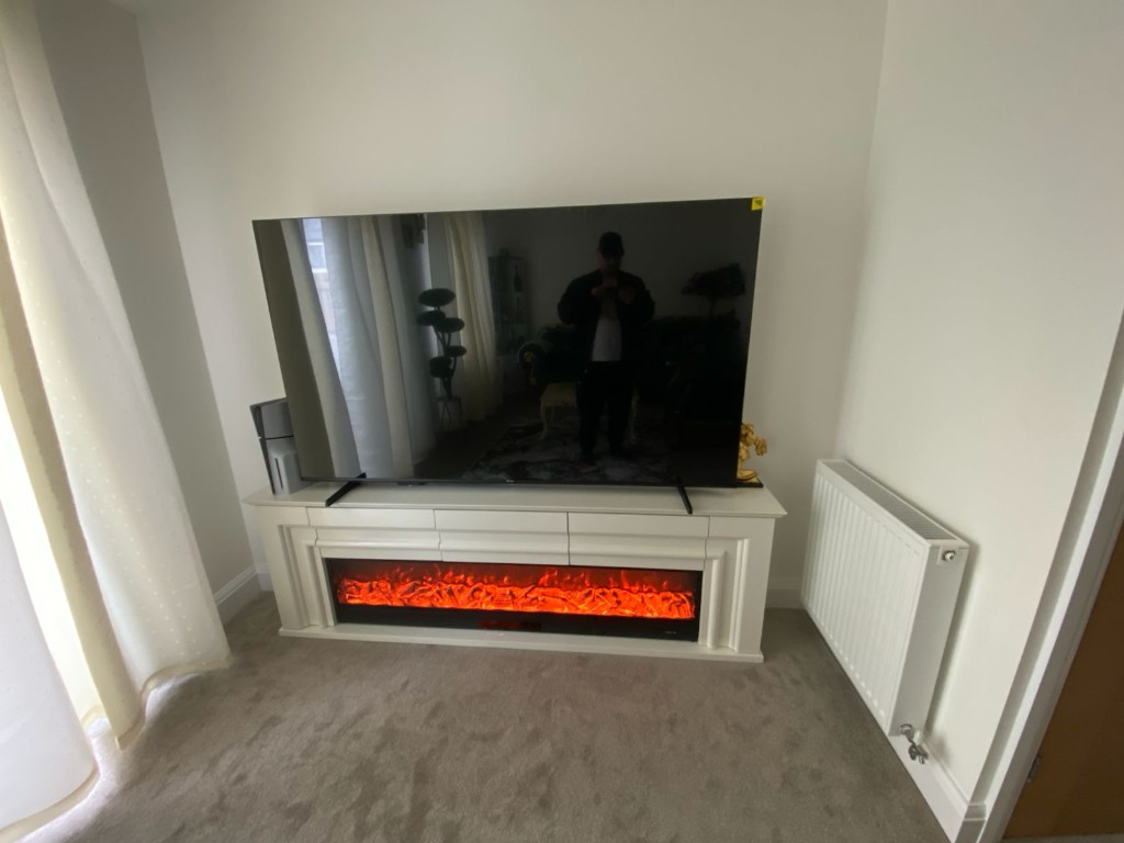 Living room before the media wall — TV on the fireplace unit